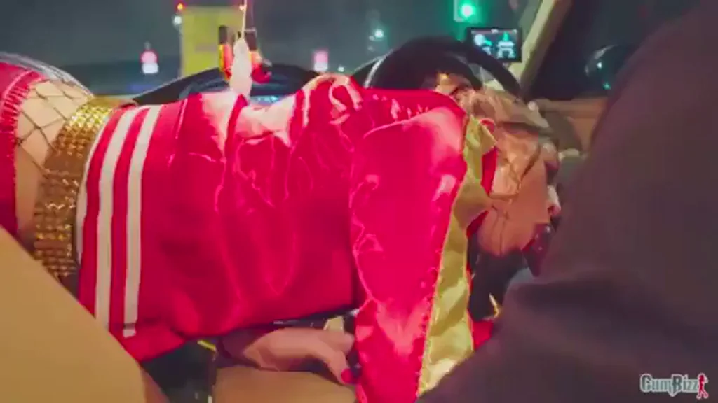 Petite British Harley Quinn cosplayer sucking a big black cock while driving in a car