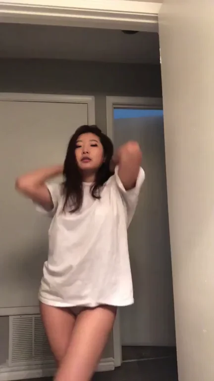 Cute Asian Tease Strips Down with Naughty Dance
