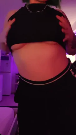 Goth GF Teases with Her Massive Tits: Top Off?