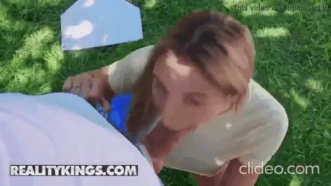Abella Danger Slurps Cock Outdoors on the Grass