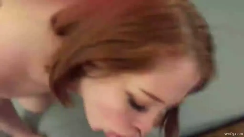 Red headed hottie giving no hands blowjob