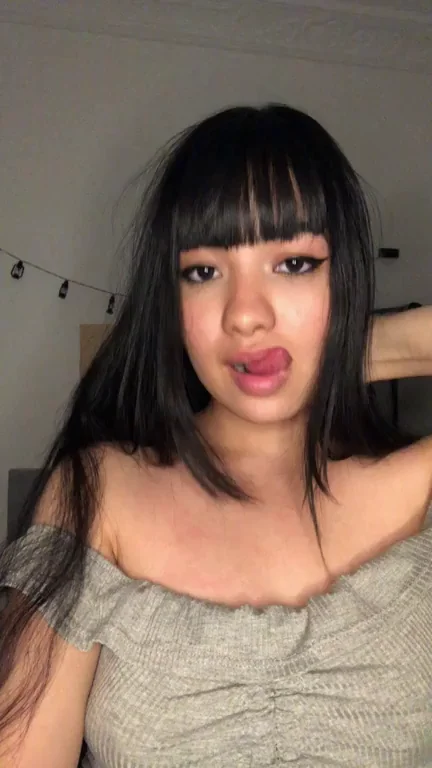 Cute Asian Babe Teases with Tits and Ass in Sultry Strip Show