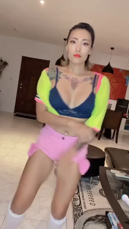 Shy Asian Babe Teases with Massive Tits & Juicy Ass in Neon Thong Shorts 😏🔥