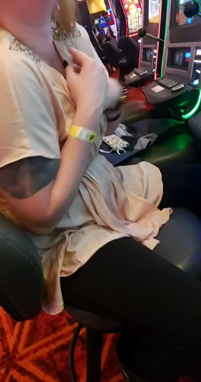 Amber C. From Lansing Michigan flashing her tittie at the casino.