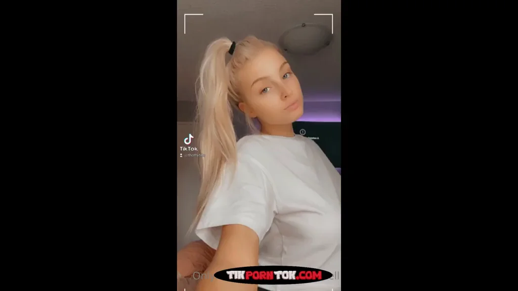Cute Blonde Teen Teases Massive Tits Under Her Shirt