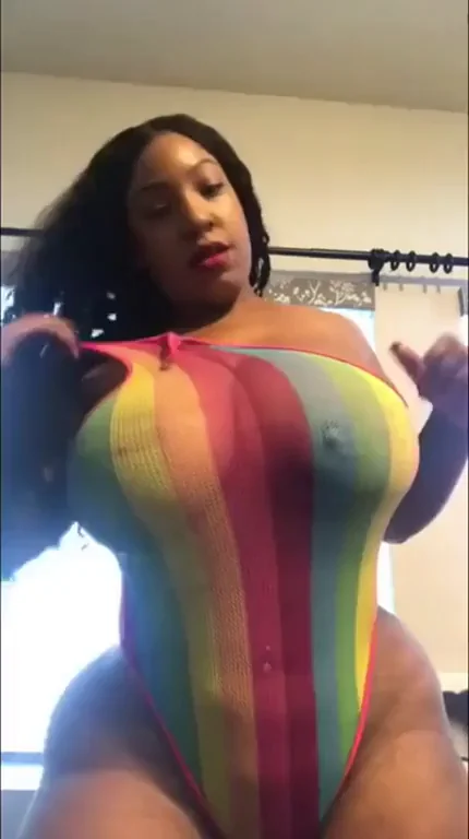 Thick Ebony Babe Teases in Rainbow Swimsuit 🍑💦 Who's This Slut?