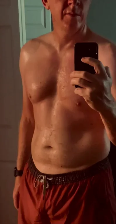Sweaty Daddy's Post-Run Breath Play in Tight Red Shorts