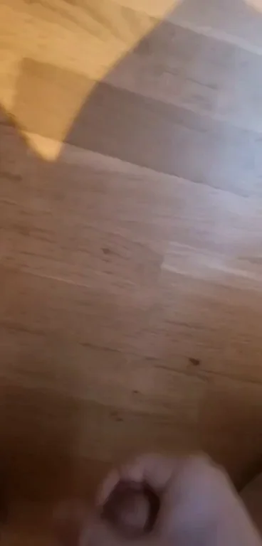 Transgirl's Massive Cock Explosion on Slick Wood