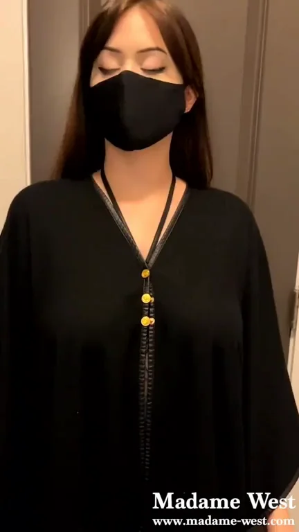 Madame West revealing her triple D's