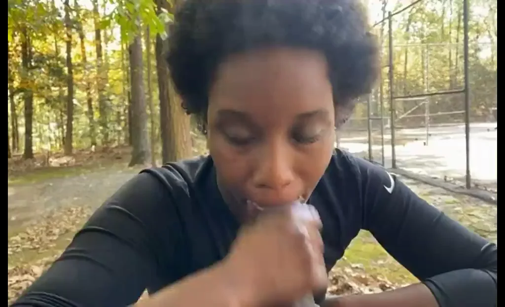 Ebony Babe Deepthroats Huge Cock in the Woods