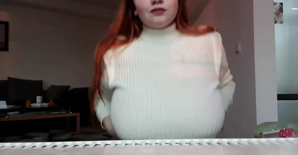 Chubby Redhead Teen's Massive Tits Tease in Tight Sweater