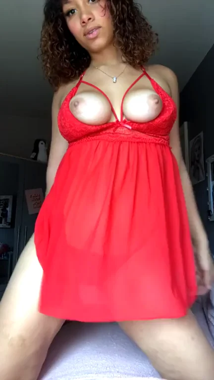 Barely Legal Ebony Tease in Red Nipple-Baring Dress
