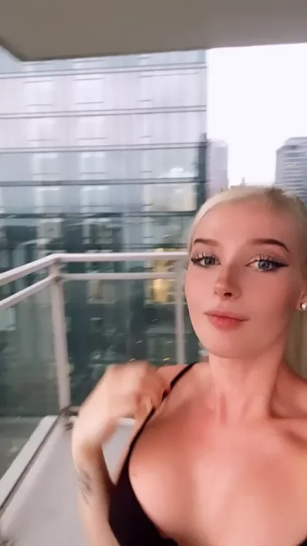 Blonde Slut Flashes Massive Tits to Neighbors from Balcony