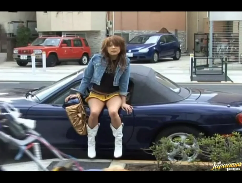 Girl getting stimulated in public by a guy in an MX5