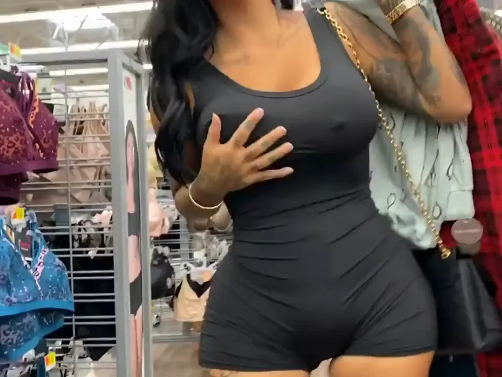 Flashing her big tits in clothing store