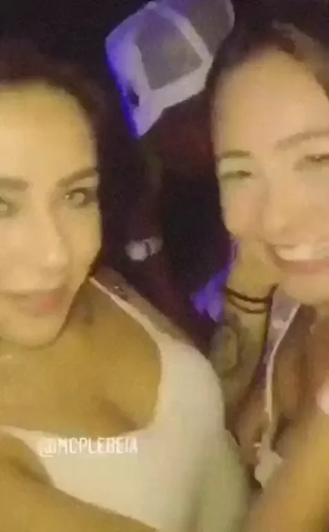 Friends kissing at a party