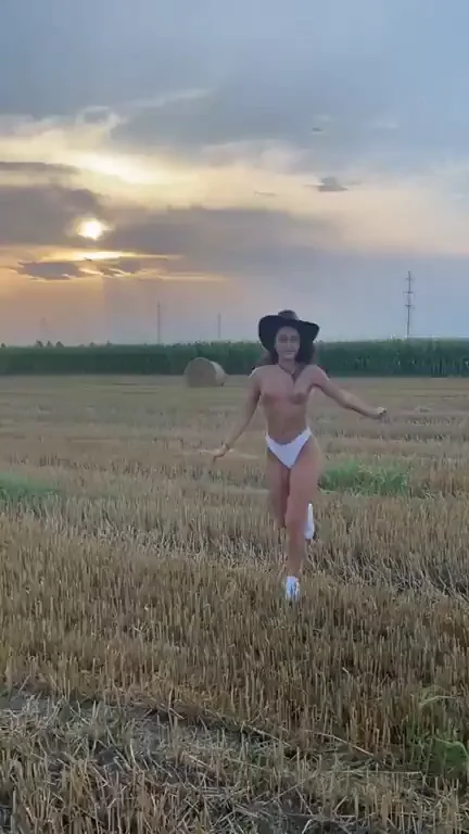 Nude Slut Runs Wild in Wheat Field at Sunset