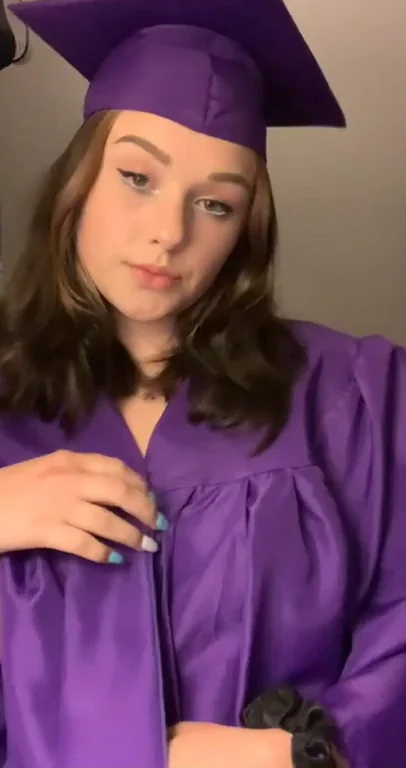 Grad Cap Tease: Purple Gown Flashed Open for Perky Tits & Smirky Vibes