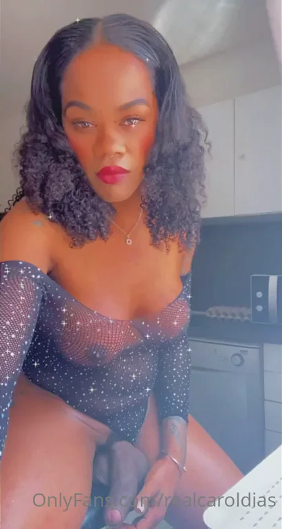 Woah! 😱 Ebony Trans Latina Flaunts Massive Cock in Sparkly Bodysuit 🍆✨