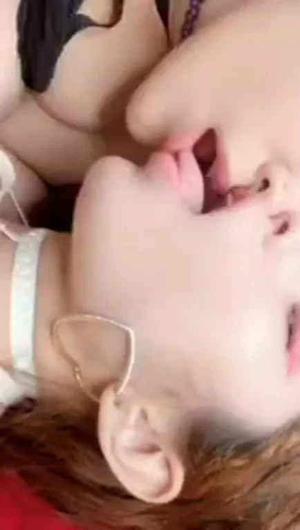 Two Slutty Babes Locked in a Steamy Tongue-Kissing Frenzy