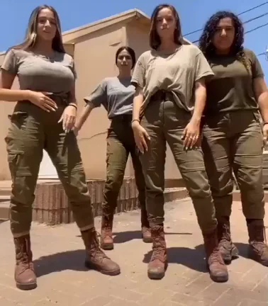Far Left Busty Babe in Camo Tease 💦🍑