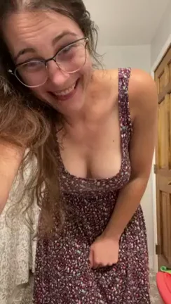 Small girl in a sundress hides a big, bouncy surprise