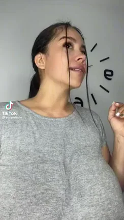 Busty Babe's Jaw-Dropping Tits Gasp in Tight Gray Tee