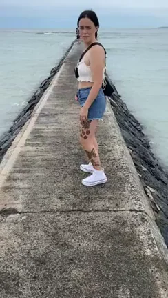 MILF Flashes Tiny Tits on Vacation Pier 😈🌊👙