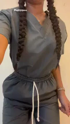 Naughty Nurse's Scrub Tease: Massive Tits Spill Out for Your Injection