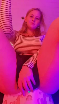 As you can see for yourself, under my mini-skirt I don't have a thong, and you can now get a close-up look as I slowly begin to caress my small and tight pussy.