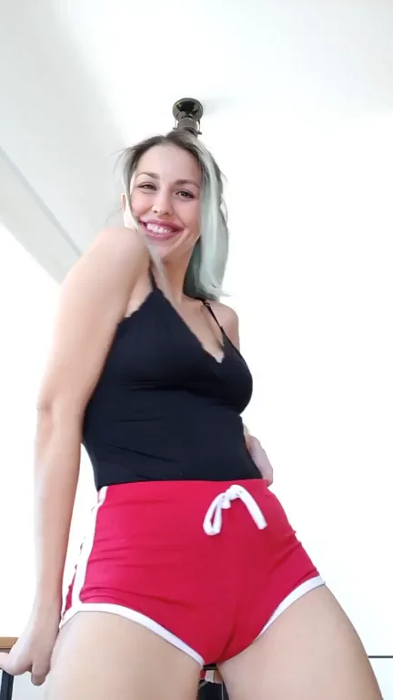 🔥 Gif: Teasing Tits & Juicy Ass in Red Hotpants 😈🍑