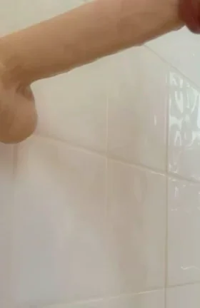 Slutty Babe Practices Deepthroating Huge Dildo in Shower
