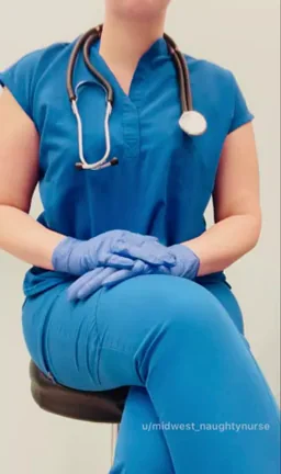 Nurse showing off for "Tits Out Tuesday"