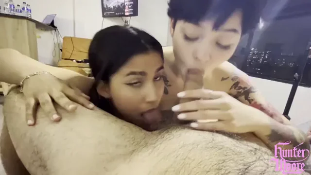 One licking your balls the other sucking