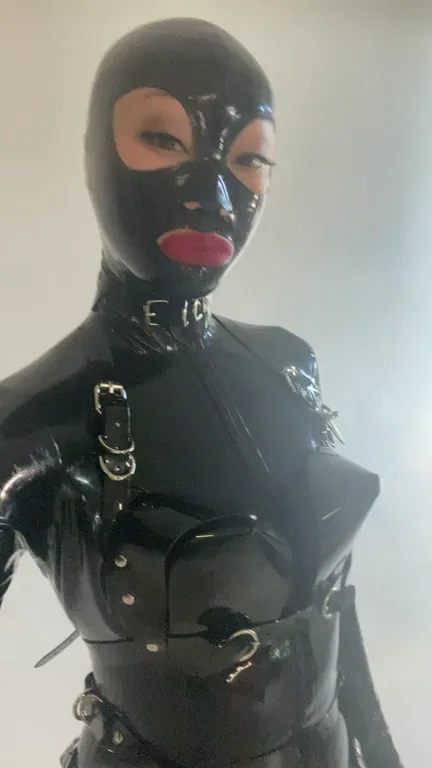 Behold the Sinister Majesty of My Full-Body Latex Suit, Enveloping Me from Head to Toe in a Veil of Unyielding Darkness.