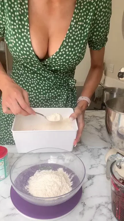 Busty Babe's Cleavage Overflow in Green Wrap Dress While Baking