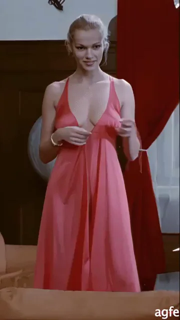 Brigitte Lahaie Teases in Sexy Pink Dress 😈💋