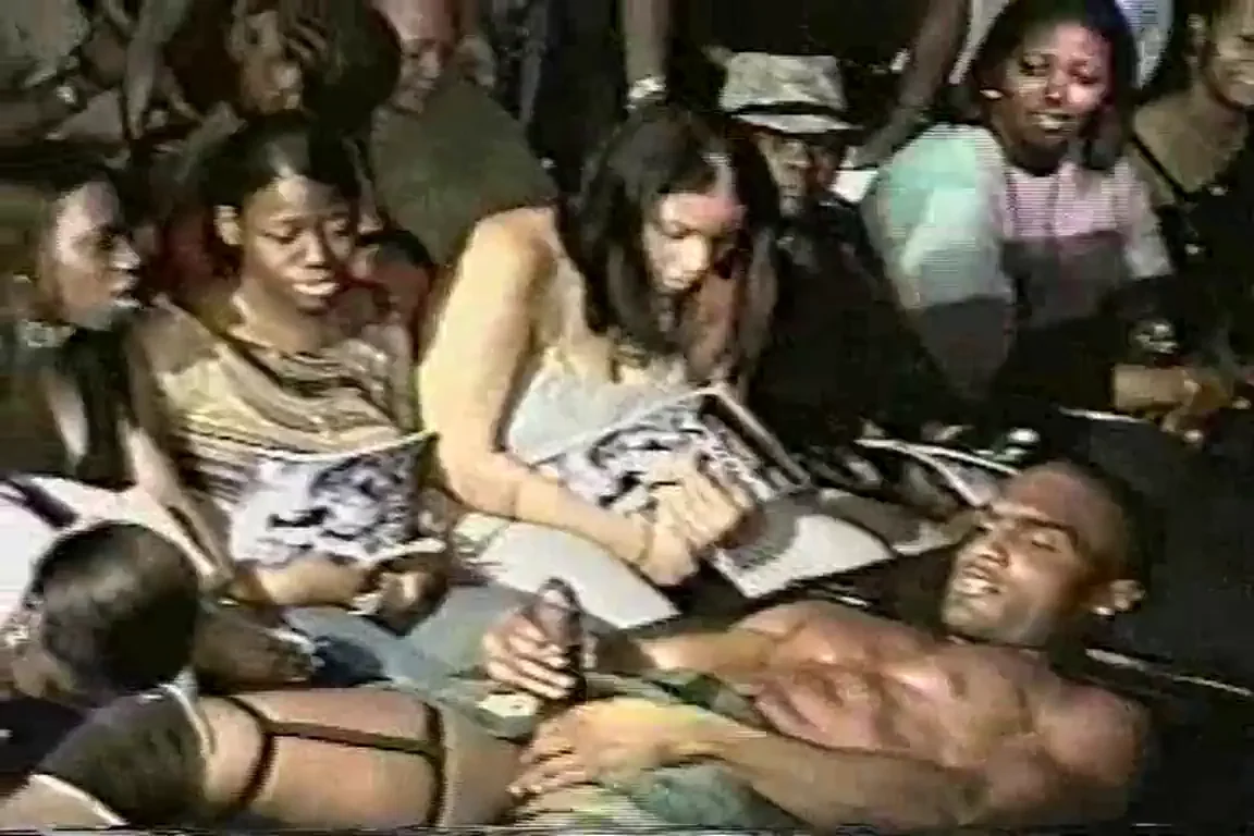 Black girl sucks the hell out of male stripper while everyone's watching in shock and awe. Next, black lady touches Hot Rod's massive dick very sensually