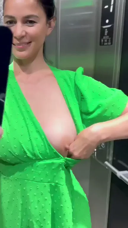 Neighbor Tease: Flashing Massive Tits in the Elevator GIF