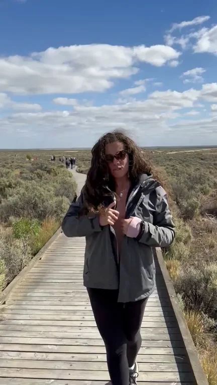 Sneaky Ass Flash on Public Boardwalk GIF