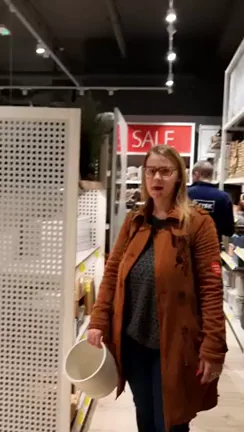 Big-Titted Slut in Glasses Shops Topless in Busy Store