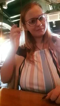 The lady in pink in the back is a waitress. She moved silently and quickly. Well, and I guess she realized that she was showing her big boobs in this restaurant.