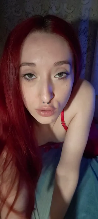 Inky Redhead Slut Teases with Sultry Pout and Killer Tattoos