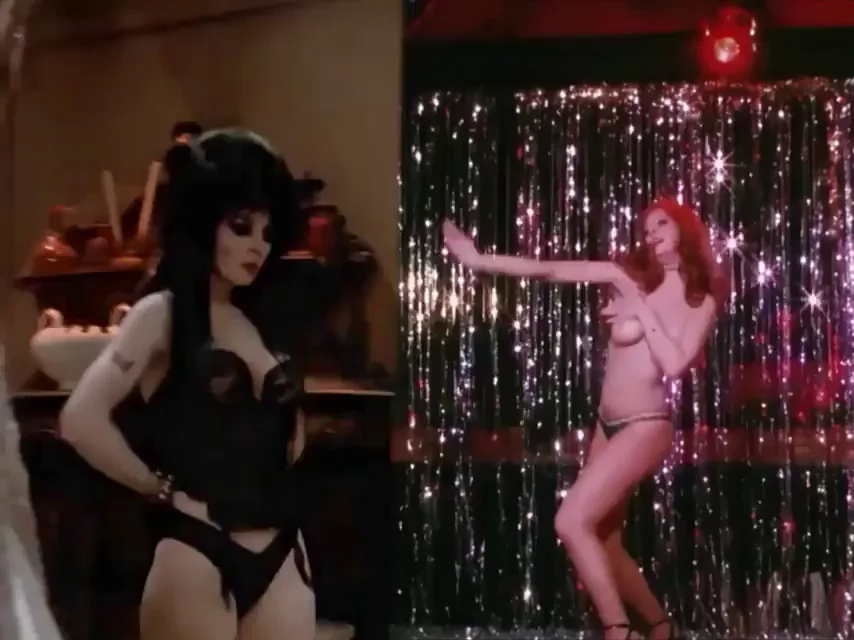 Cassandra Peterson in Elvira: Mistress of the Dark and The Working Girls (1988)
