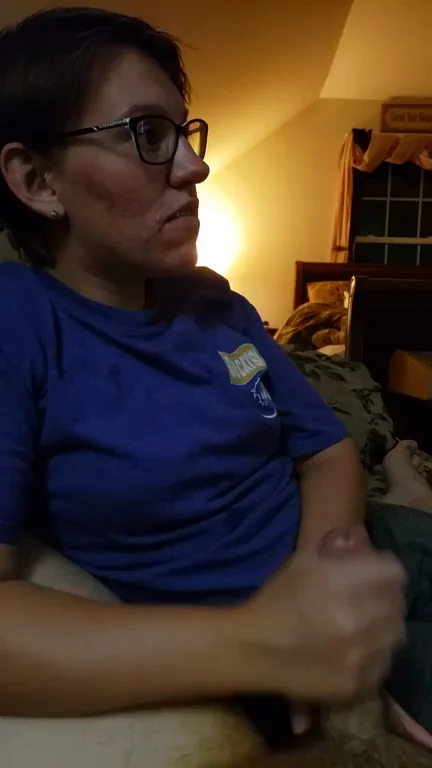 Stroking my cock while watching TV