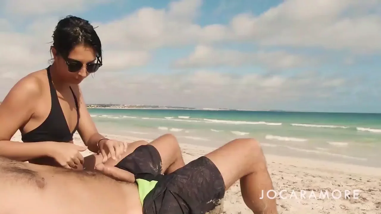 Risky Beach Handjob: Slutty Babe Jerks Dude in Broad Daylight!