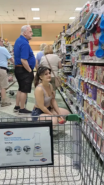Flashing with shoppers all around
