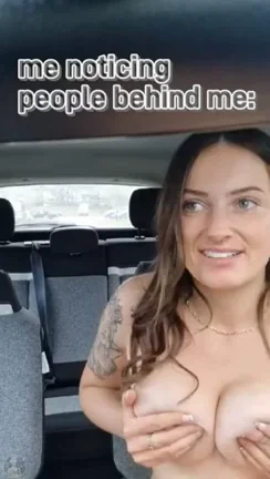 Thrill Seeker's Car Tit Tease: Public Flash with Eyes on Her Slutty Curves