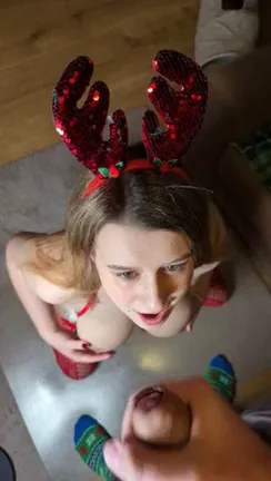 Busty slut on her knees getting a monster facial