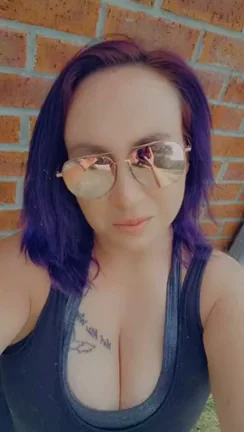 Purple-Haired MILF's Massive Cleavage Begs for Worship